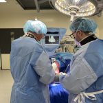 During surgery, Timothy Schneider, MBBS, FRACS, operates with GPS Ankle, then captures the moment afterward with the O.R. team.